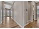 Bright hallway with hardwood floors leading to various rooms in the home at 4213 Hickory Oaks St, Castle Rock, CO 80104