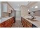 A partial view of the kitchenette with a stainless steel refrigerator and light countertops offering practical convenience at 4213 Hickory Oaks St, Castle Rock, CO 80104