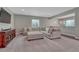 Comfortable recreation room with a large sectional sofa, TV, and partial view of the snack bar for relaxed entertaining at 4213 Hickory Oaks St, Castle Rock, CO 80104