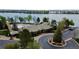 Aerial view of a community building with pool, lush landscaping, and convenient parking, located by a serene lake at 6614 W Gould Dr, Littleton, CO 80123