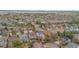 Aerial view of a densely populated neighborhood with a mix of housing styles and mature trees at 6614 W Gould Dr, Littleton, CO 80123