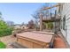 Backyard features a hot tub, spiral staircase to upper deck, and stone fire pit with outdoor seating at 6614 W Gould Dr, Littleton, CO 80123