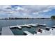 Picturesque boat docks on a serene lake under a blue sky with fluffy clouds offer convenient water access at 6614 W Gould Dr, Littleton, CO 80123
