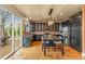 Modern kitchen with dark cabinetry, a center island with seating, and stainless steel appliances at 6614 W Gould Dr, Littleton, CO 80123