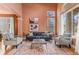 Comfortable living room with hardwood floors, neutral walls, and large windows with natural light at 6614 W Gould Dr, Littleton, CO 80123