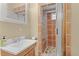 Bathroom featuring a tiled shower and vanity with ample storage at 12191 Tecumseh Trl, Conifer, CO 80433