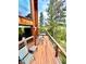 Open wood deck has chairs for relaxation and tree views at 12191 Tecumseh Trl, Conifer, CO 80433