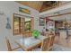 Cozy dining room with hardwood floors, natural lighting, and an open layout at 12191 Tecumseh Trl, Conifer, CO 80433