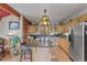 Well-lit kitchen with stainless steel appliances, a granite island, and ample cabinet space at 12191 Tecumseh Trl, Conifer, CO 80433