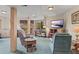 Basement living area with a wet bar and walk-out to the deck at 12191 Tecumseh Trl, Conifer, CO 80433