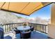 Outdoor balcony with seating offers a scenic view of the surrounding landscape and a relaxing atmosphere at 5668 Red Fern Ct, Littleton, CO 80125