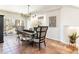 Dining room features natural light, stylish decor, and access to the outdoors at 5668 Red Fern Ct, Littleton, CO 80125