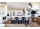 Bright kitchen features a spacious island with seating, modern appliances, and ample cabinet space at 5668 Red Fern Ct, Littleton, CO 80125