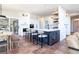 Bright kitchen with a large center island, bar seating, and stainless steel appliances at 5668 Red Fern Ct, Littleton, CO 80125
