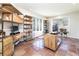 Bright home office with built-in shelving and large windows offering scenic views at 5668 Red Fern Ct, Littleton, CO 80125