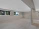 Open basement with carpet, recessed lighting, columns, and windows at 86 Woodland Cir, Highlands Ranch, CO 80126