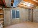 Unfinished basement is ready for storage or your creative design and features a small window at 86 Woodland Cir, Highlands Ranch, CO 80126