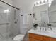 Renovated bathroom boasts a glass shower, updated fixtures, and modern vanity at 86 Woodland Cir, Highlands Ranch, CO 80126