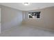 Bedroom with carpet, a window, and neutral walls at 86 Woodland Cir, Highlands Ranch, CO 80126