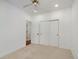 Bedroom with a ceiling fan, closet, and neutral carpet and walls at 86 Woodland Cir, Highlands Ranch, CO 80126
