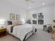 Calm bedroom with neutral bedding, plantation shutters, and a ceiling fan at 86 Woodland Cir, Highlands Ranch, CO 80126