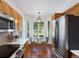 Well-lit kitchen nook with stainless steel appliances and hardwood floors, perfect for enjoying casual meals and entertaining at 86 Woodland Cir, Highlands Ranch, CO 80126