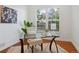 Bright office space with natural light, plantation shutters, and a glass-topped desk at 86 Woodland Cir, Highlands Ranch, CO 80126