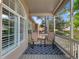Patio with new blue rug and patio furniture in front of large living room window at 86 Woodland Cir, Highlands Ranch, CO 80126