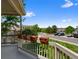 Deck overlooking a street with planters on the railing, a great spot to unwind at 86 Woodland Cir, Highlands Ranch, CO 80126