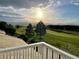 Scenic view from the balcony, featuring a golf course and distant mountains at 3075 Greensborough Dr, Highlands Ranch, CO 80129