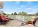 Outdoor patio area with seating overlooking neighborhood and landscape at 3075 Greensborough Dr, Highlands Ranch, CO 80129