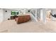 Finished basement with large entertainment area and a carpeted floor at 3075 Greensborough Dr, Highlands Ranch, CO 80129