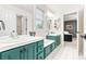 Bright, clean bathroom with double vanity and storage, plus access to the Primary bedroom at 3075 Greensborough Dr, Highlands Ranch, CO 80129