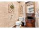 Elegant powder room with unique vessel sink and decorative wall accents at 3075 Greensborough Dr, Highlands Ranch, CO 80129