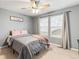 Inviting bedroom with neutral walls, plush bedding, and a window view for a serene atmosphere at 3075 Greensborough Dr, Highlands Ranch, CO 80129