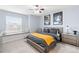 Comfortable bedroom with gray decor, bright window nook, and unique Star Wars and Lord of the Rings art at 3075 Greensborough Dr, Highlands Ranch, CO 80129
