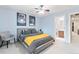 Cozy bedroom with ensuite bathroom access, neutral tones, and modern furnishings, creating a relaxing retreat at 3075 Greensborough Dr, Highlands Ranch, CO 80129