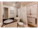 Standard bathroom with neutral color palate featuring a combination shower and tub and updated vanity at 7682 S Cove Cir, Centennial, CO 80122