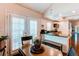 Cozy dining area featuring french doors, adjacent to the kitchen with modern appliances at 7682 S Cove Cir, Centennial, CO 80122