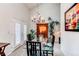 Elegant dining room with a glass-top table, chandelier lighting, and ample space for entertaining at 7682 S Cove Cir, Centennial, CO 80122
