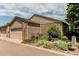 Well maintained home with a two-car garage, brick exterior, beautiful garden, and inviting curb appeal at 7682 S Cove Cir, Centennial, CO 80122