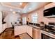 Modern kitchen featuring granite countertops, stainless steel appliances, and a breakfast bar area at 7682 S Cove Cir, Centennial, CO 80122