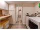 Efficient laundry room featuring a washer, dryer, countertop, cabinets, and convenient storage options at 7682 S Cove Cir, Centennial, CO 80122