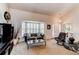Comfortable living room with a bay window, neutral tones, and a welcoming atmosphere at 7682 S Cove Cir, Centennial, CO 80122