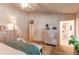 Main bedroom showing ensuite bathroom, closet, and dresser at 7682 S Cove Cir, Centennial, CO 80122