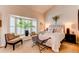Serene main bedroom featuring a large window, and sitting area at 7682 S Cove Cir, Centennial, CO 80122