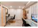 Finished basement office provides ample workspace featuring closets, sleek desks and neutral flooring at 7682 S Cove Cir, Centennial, CO 80122