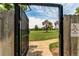 Community park view through an open gate with a 'Pets Must Be On Leash' sign on the right at 7682 S Cove Cir, Centennial, CO 80122