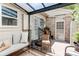Enclosed patio with comfortable seating and covered pergola, offering a private outdoor living space at 7682 S Cove Cir, Centennial, CO 80122