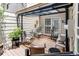 Enclosed patio with comfortable seating and covered pergola, offering a private outdoor living space at 7682 S Cove Cir, Centennial, CO 80122
